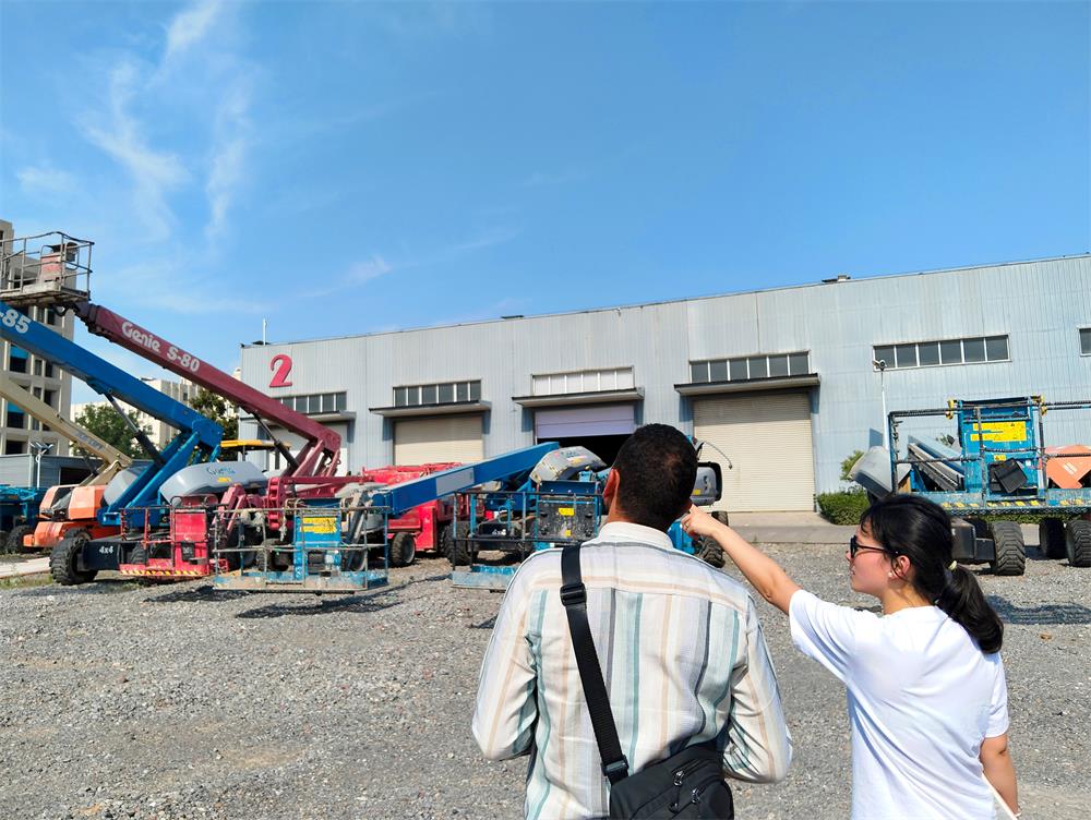 Egyptian clients inspecting machinery at the factory
